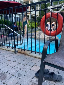Candid Girl in a One-Piece Swimsuit by the Pool Creepshots