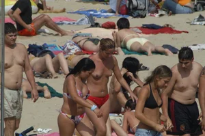 Topless girls on a beach in Barcelona