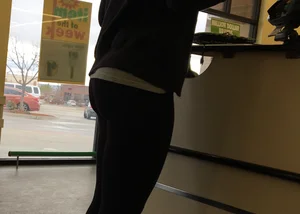 Thick booty girl shopping at Dollar Tree in leggings