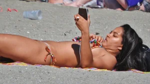 Pretty brunette in a bikini at the beach