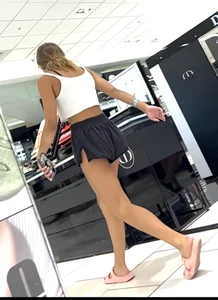 Cheeky short shorts blonde going up escalator