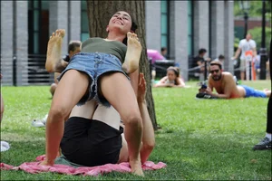 Gymnast or yoga girl in the park in shorts and no bra and even showing some pussy