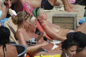 Topless girls on a beach in Barcelona