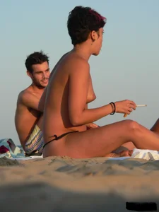 Sexy girls going topless at the beach showing off their sexy bodies