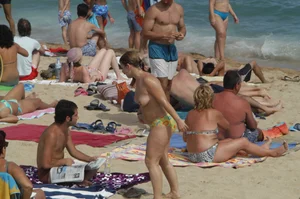 Topless girls on a beach in Barcelona