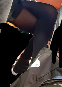 Legs of candid college teens wearing pantyhose in class
