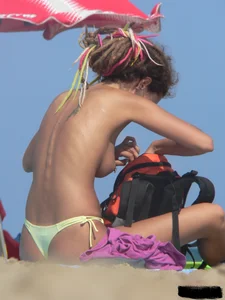 Sexy girls going topless at the beach showing off their sexy bodies