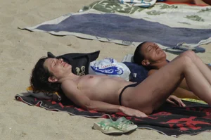 Topless girls on a beach in Barcelona