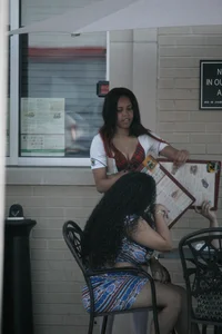 Two sexy Tilted Kilt employees showing cleavage and cheeks