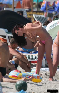 A bunch of sexy beach voyeur babes in bikinis, thongs and topless