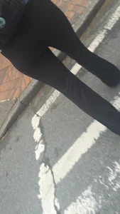 Girl with a nice ass in leggings walking down the street
