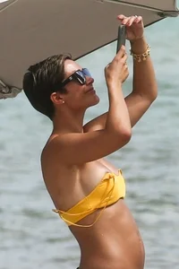 Frankie Bridge nip slips in a bikini on the beach