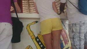 Milf in yellow shorts with vpl and a wedgie