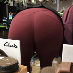 MILF in red leggings bends for the camera