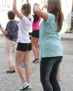 Girl Working Out on the City Street Candid Photos
