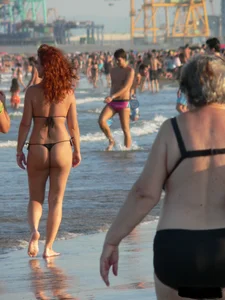 Bunch of sexy babes at the beach in thong bikinis