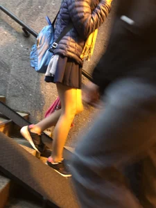Girl With Skinny Legs in Pahtyhose and a Skirt Walking Down the Stairs Street Candid Gallery