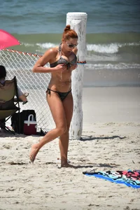 Redhead with nice tits in a bikini on the beach