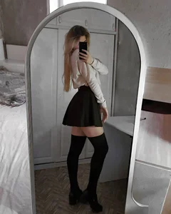 Girl in Black Knee Socks, Short Skirt and a Blouse Selfie in the Mirror