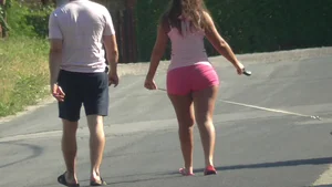 Thick booty babe walking her dogs in pink shorts