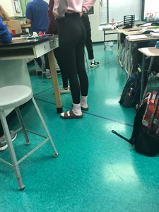 College teen wearing tight in class