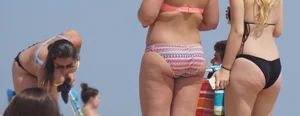 Thick girl on the beach in a bikini