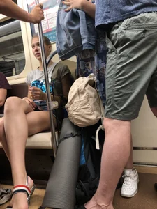 Tall Candid Teen Girl in Denim Shorts And Sandals Sitting in the Subway Train, Then Walking Down the Station