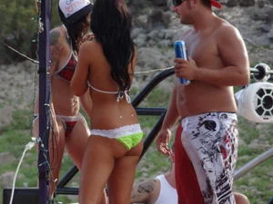 Party girls looking sexy out on boats in bikinis