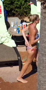 Blonde babe at the pool with sexy body in USA bikini