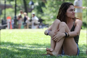 Gymnast or yoga girl in the park in shorts and no bra and even showing some pussy