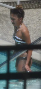 Sexy Asian girl with tattoos in a thong bikini