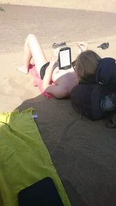 Topless teen girlfriend on the beach with nice tits