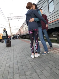 Skinny Teen With Nice Thin Legs in Spandex Tights Hugging Her Friends at a Railway Station Photos