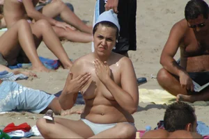Girls on a nude beach in Sitges, Spain
