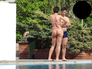 Milf at the pool in a pink bikini with camel toe