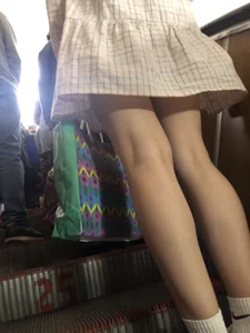 Cute Girl in a Dress with Thin Hot Legs Standing on the Subway Escalator Closeup Creepshots Gallery