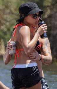 Sexy party girls in bikinis on a lake