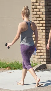 Sexy blonde out walking in purple leggings with a nice ass