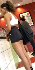 hot petite Indian chick showing some T&A in skimpy workout clothes