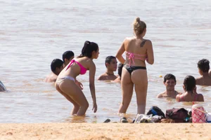 Candid beach girls in thongs