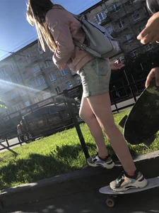 Girl in Denim Shorts on Skateboard Street Candid Photos