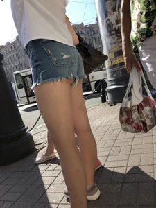 Awesome ass in fringed denim shorts and perfect legs, candid girl's street photos