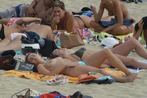 Topless girls on a beach in Barcelona