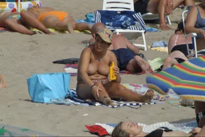 Girls on a nude beach in Sitges, Spain