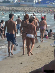 Bunch of sexy babes at the beach in thong bikinis