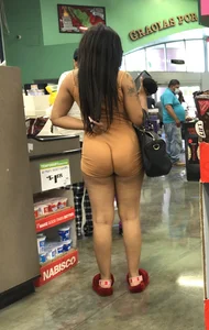 Latina with hard nipples and a big booty in tight spandex shorts outfit