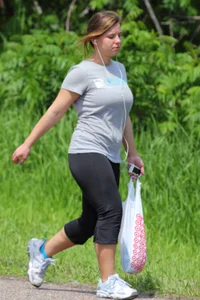 Thick girl out walking in black leggings