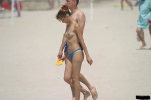 A bunch of sexy beach voyeur babes in bikinis, thongs and topless