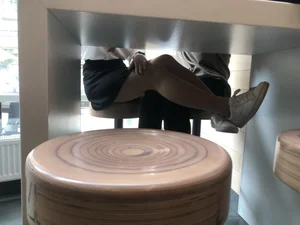 Girl in a Skirt and Pantyhose Touching Herself Under a Table at a Restaurant Creepshots Collection