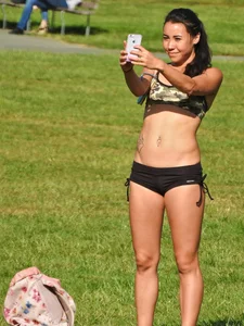 Fit brunette posing in the park. With hoops! [011]